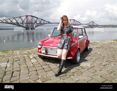 Young Girl Model Pictured With A Mini Cooper On The Pier Overlooking