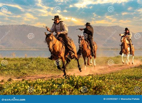 A Group Of Cowboys Riding Horses Stock Image Image Of Landscape