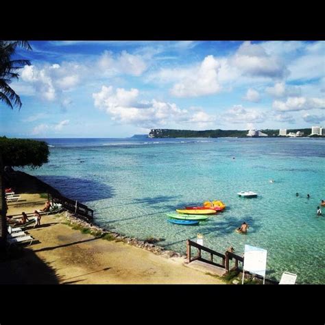 Guam Beautiful Water Palm Trees Kayaks And Clear Blue Skies