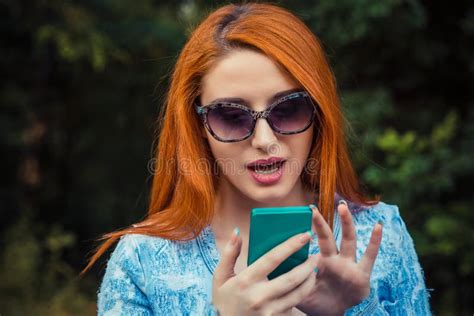 Anxious Shocked Girl Looking At Phone Seeing Bad News With Stunned