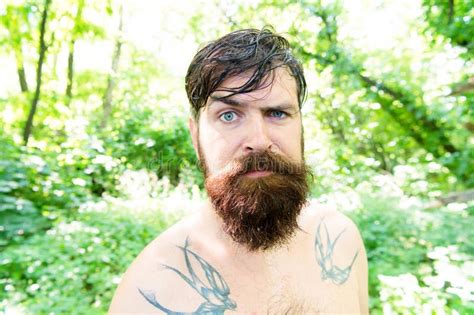 Brutal And Rugged Hairy Hipster Wearing Long Beard And Mustache In