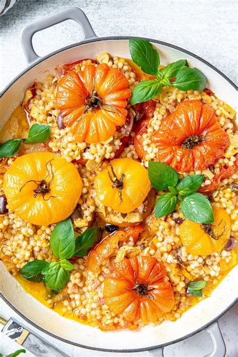 Mediterranean Couscous Stuffed Tomatoes With Feta And Artichokes