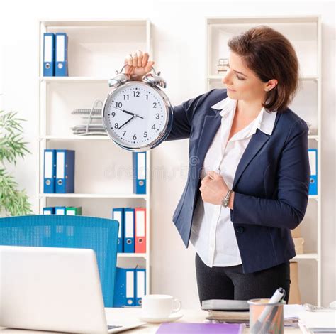 middle aged female employee sitting at the office stock image image of company office 269656711
