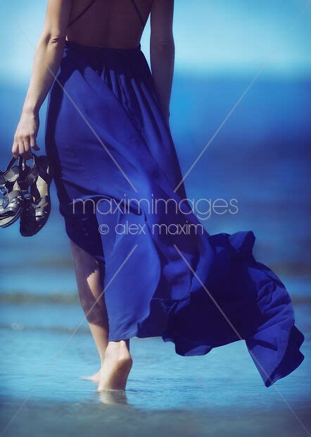 Photo Of Woman In Blue Summer Dress Blowing In The Wind Walking