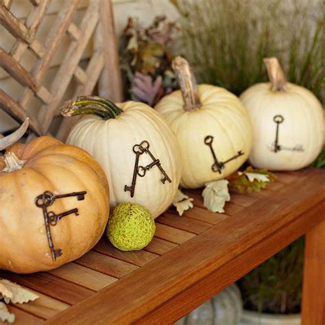 Carve slits for the handles and attach them with strong glue. 70 Pumpkin Décor Ideas For Home Fall Décor - DigsDigs