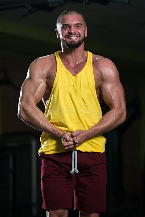 Muscular Man Flexing Muscles In Gym Stock Photo Image Of Muscles