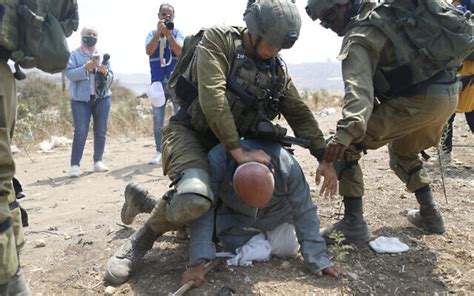 Palestinian Activist Arrested After Idf Soldier Filmed Kneeling On His