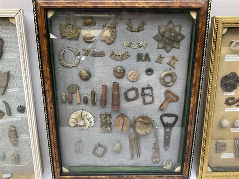 Collection Of Metal Detecting Finds Most Contained Within Display