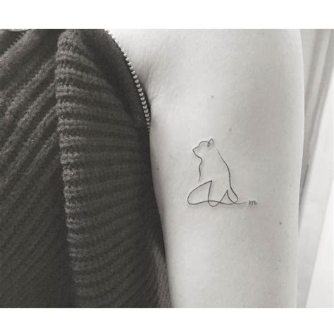 One Line Dog Tattoo Located On The Upper Arm