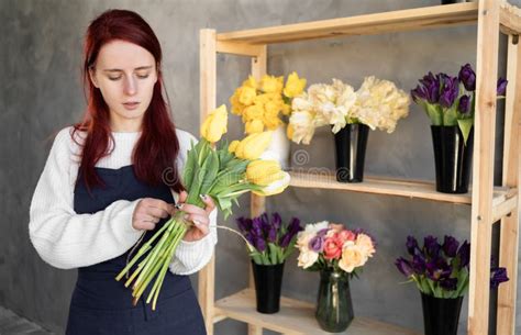 European Flower Shop Concept A Female Florist Creates A Beautiful