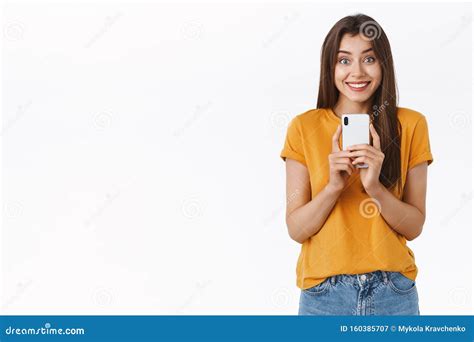 Excited Enthusiastic Good Looking Brunette Woman Attend Awesome Event Holding Smartphone Near