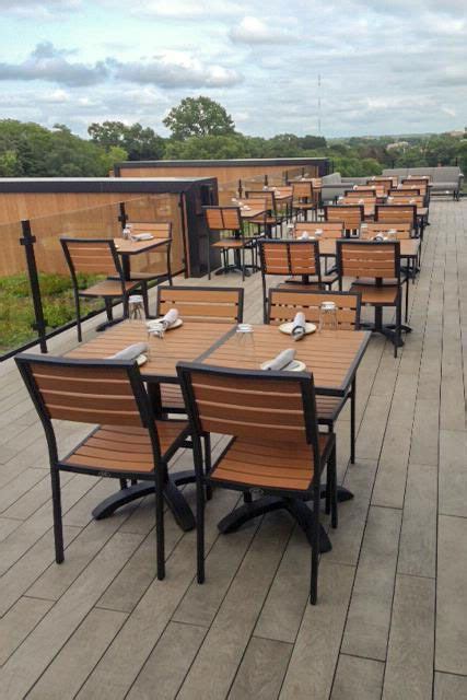 Tables And Chairs Are Lined Up On The Deck