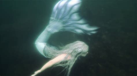 Mermaid Swimming In A Haunted Lake Performing Underwater Tricks In