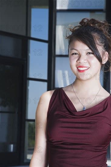 Glamorous Asian Woman Smiling Photo12 Tetra Images Tanya Constantine