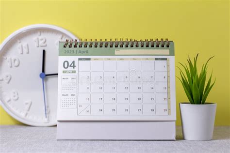 Hello Aprildesktop Calendar For April 2023 On The Table Stock Image