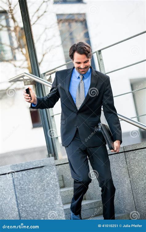 Smiling Businessman Walking Down Stairs Stock Image Image Of Smiling