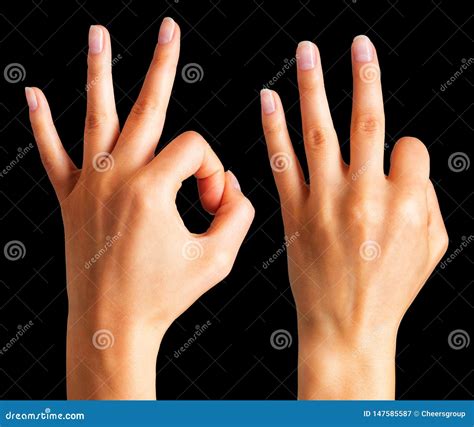 Woman Hands Holding Gesture Of Okay And Showing Three Fingers Stock