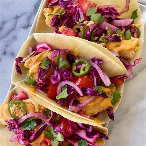 Crispy Fish Tacos With Fresh Cabbage Slaw And Sriracha Aioli