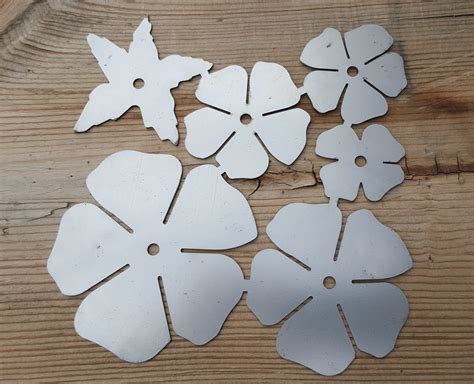Then, i use a pattern or template that i printed off to cut the petals out of the sheet metal using tin snips. Rose Blanks