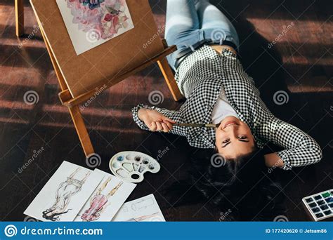 Woman Dreaming Laying On The Floor With Sketches Stock Photo Image Of