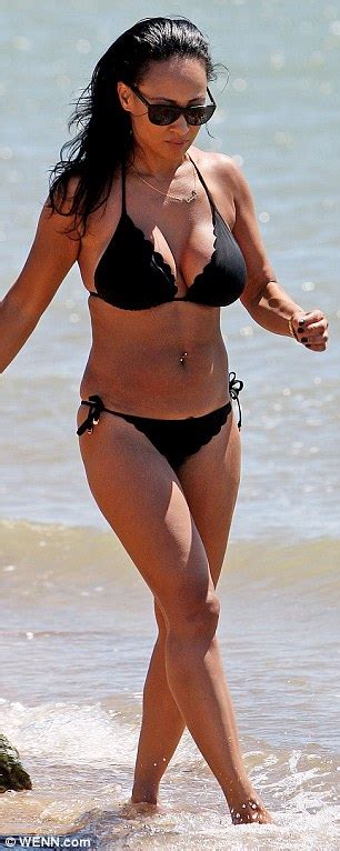 katching my i so solid crew s lisa maffia shows off her enviable curves in plunging black