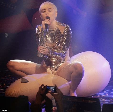 Miley Cyrus Performs In London As She Rides On A Giant Blown Up Penis On Stage
