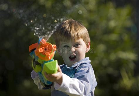 Squirt Gun Kid Stock Image Image Of Closeup Action