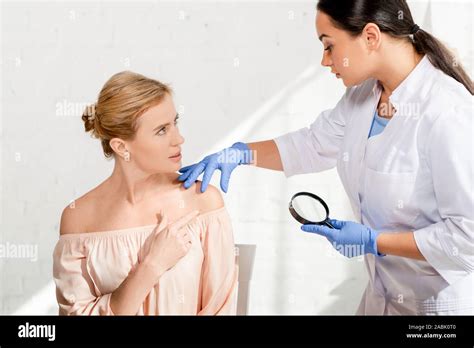 Dermatologist Examining Patient Magnifying Glass Hi Res Stock Photography And Images Alamy