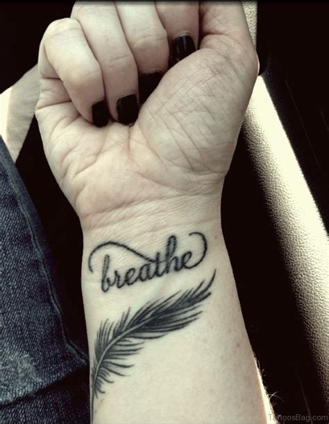 Cute Feather Tattoo On Wrist Tattoo Designs Tattoosbag Com