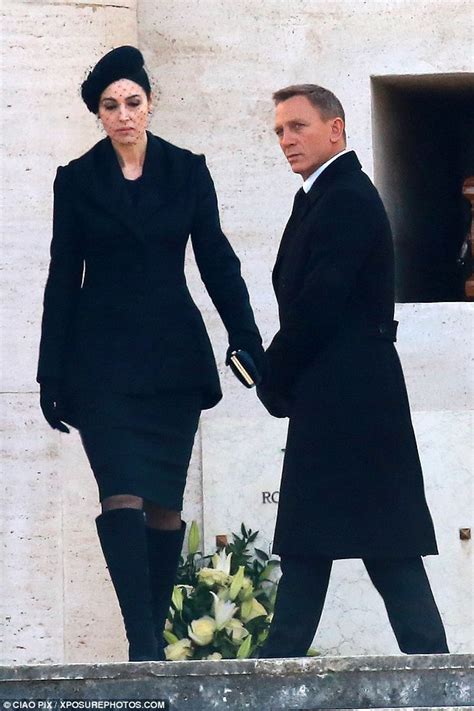 Spectre Co Stars Daniel Craig And Monica Bellucci Shoot Sombre Funeral