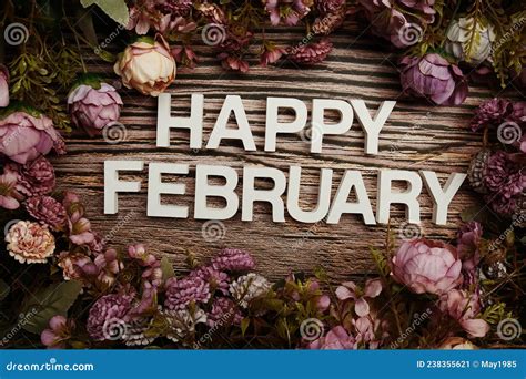 Happy February Alphabet Letters With Flowers Frame On Wooden Background