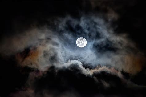 A Full Moon Rising Over Clouds Like Mountains By Augenstudios On Deviantart