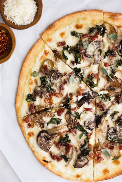 White Sauce Pizza With Prosciutto Caramelized Onions Kale And Mushrooms