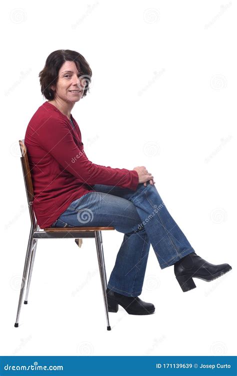 Portrait Of A Woman Sitting On A Chair In White Backgroundlookig At