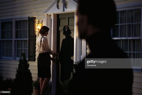 Stalker Spying On Woman At Front Door High Res Stock Photo Getty Images