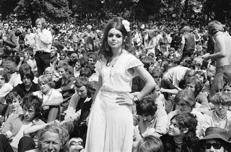A Woman Standing Among The Crowds Gathered In Hyde Park To See The Rolling Stones In Concert