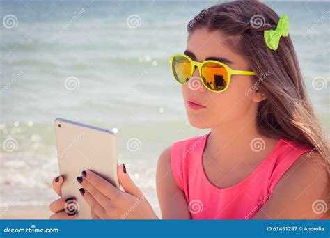 Portrait Of A Pretty Teenage Girl In Sunglasses On A Beach Stock Image Image Of Beautiful