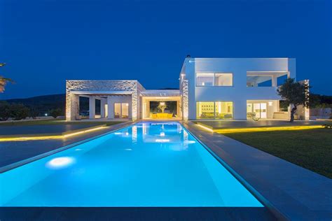 Two Storeys Villa In Greece With Large Openings On Both Levels