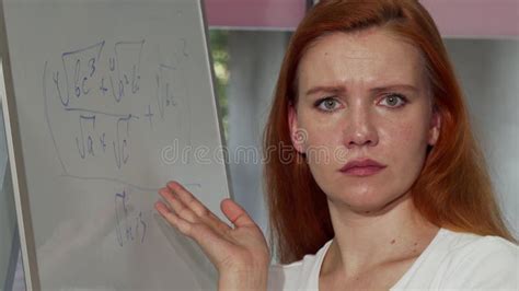 Young Red Haired Woman Looking Puzzled While Solving Math Problem Stock Image Image Of