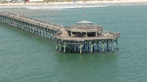 An Aerial View Of A Pier In The Ocean