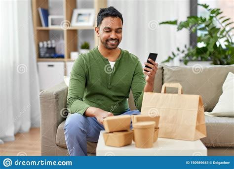 Craving for food and drinks in the office? Indian Man Using Smartphone For Food Delivery Stock Image ...