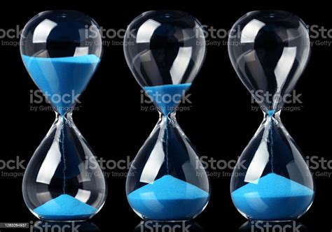 Collection Of Hourglasses With Blue Sand Showing The Passage Of Time