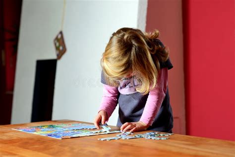 110 Cute Girl Doing Jigsaw Puzzle Stock Photos Free And Royalty Free