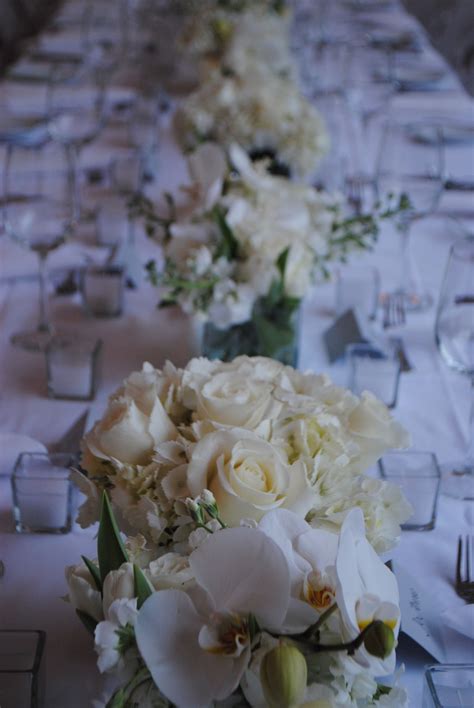 Small White Rose Centerpieces Add An Elegant And Classic Touch To A
