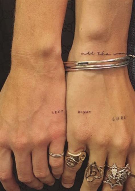 Two People Holding Hands With Tattoos On Their Wrists And The Words