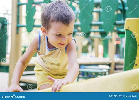 Little Kid On A Playground Child Playing Outdoors In Summer Kids Play