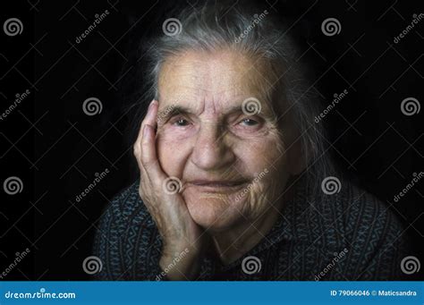 Portrait Of A Nostalgic Elderly Woman Evoking The Past Stock Photo