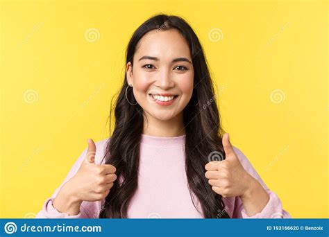 People Emotions Lifestyle Leisure And Beauty Concept Upbeat Smiling Asian Girl Showing Thumbs