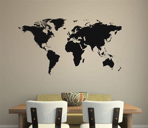 A Wall Decal With The World Map On Its Side In Black And White