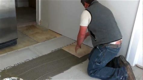 Find the midpoint of each wall and snap chalk lines on the floor. How to install ceramic tiles on a floor - YouTube